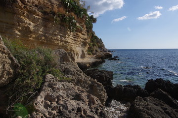 Fototapeta na wymiar Rocky beach in Sicily on Cape Zafferano