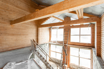 attic floor of the house. overhaul and reconstruction. Working process of warming inside part of roof. House or apartment is under construction, remodeling, renovation, restoration.