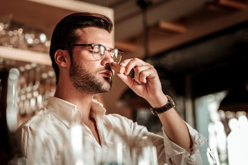 Close up of brunette man that working in bar