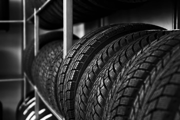 Car tires in automobile store, closeup