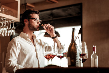 Handsome bearded male person enjoying working process