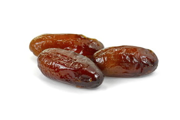 Dried dates over white background. Heap of dried dates isolated on white background.