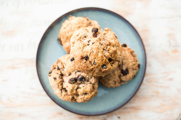 Fruit scones - freshly baked raisins and cinnamon scones on vintage plate