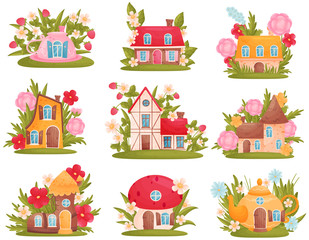 Set of fabulous houses of different shapes among the flowers and grass. Vector illustration on white background.