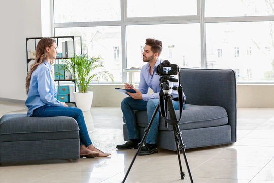 Human resources manager interviewing woman in office