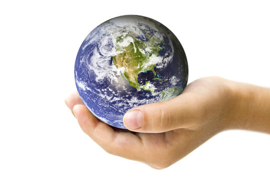 A Child's hand holding the Earth - concept for protecting the planet for the future. Earth image courtecy of NASA.