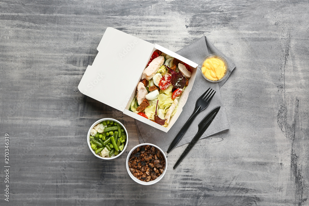 Sticker Containers with delicious food on grey background