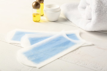 Wax stripes for hair removal on table