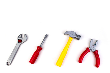 Toy. professional repairing implements for decorating and building renovation set on the on white background. Electrical tools. Top view. Copy space for text.