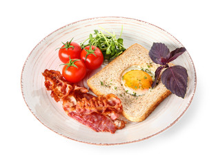 Plate with tasty toasted bread, fried egg, bacon and tomato on white background