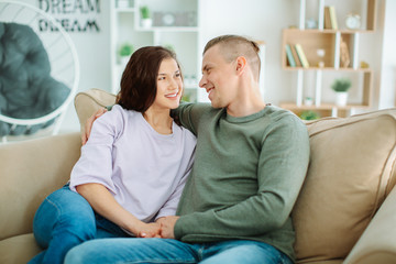 Obraz premium Adorable loving couple resting at home