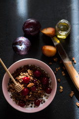 Breakfast with granola, cherry and honey.healthy breakfast Proper nutrition.