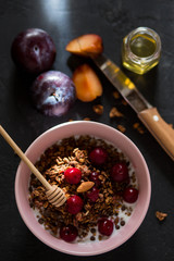 Breakfast with granola, cherry and honey.healthy breakfast Proper nutrition.