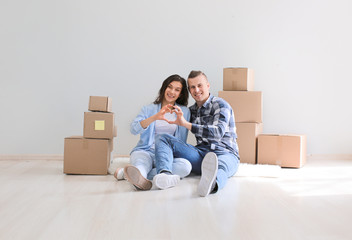 Adorable loving couple after moving into new house