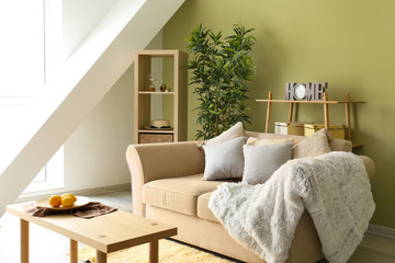 Interior of modern room with comfortable sofa