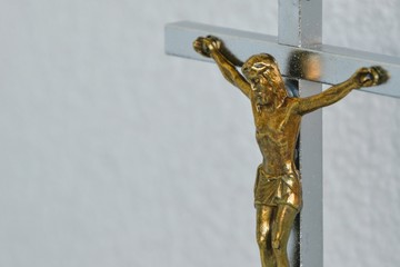 Bronze crucifix. Image of Jesus Christ on the cross. Brass Cross with crucified Jesus Christ. Place for text.