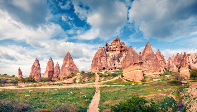Great spring scene of Cappadocia. Picturesque morning view of of Red Rose valley in April. Cavusin village located, district of Nevsehir, Turkey, Asia. Traveling concept background.