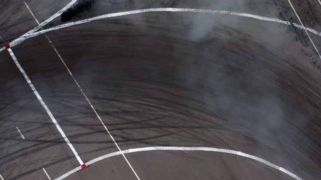 4K, Two car drift battle with smoke, Aerial top view of two car drifting on the race track.