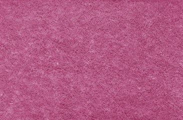 Old grungy canvas pattern with dirty spots in pink color.