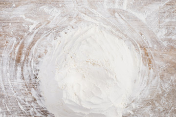 Top view of flour on wooden surface