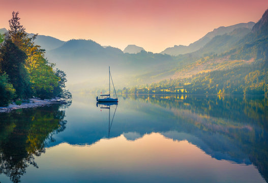 Impressive sunrise of Grundlsee lake. Beautiful summer view of Gessl village, Liezen District of Styria, Austria, Alps. Europe. Beauty of countryside concept background.