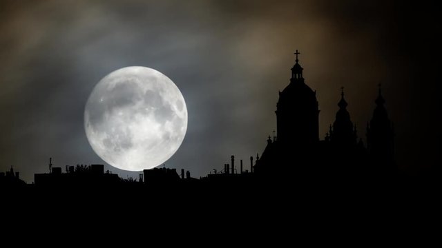Amsterdam: Skyline of Historical Area by Night with Full Moon, the capital and most populous city of the Netherlands