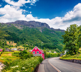 Empty road in Norwagian town - Odda,  Hordaland county, Norway. Beautiful summer view of North. Traveling concept background.