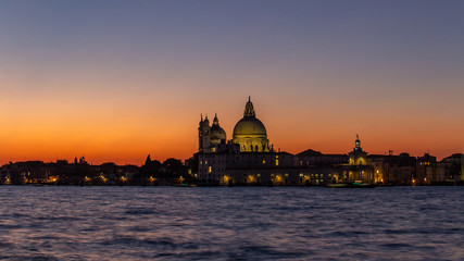 Classic sunset Venice on the Grand Canal near the Basilica of Santa Maria della Salute, Venice....
