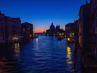 Naklejka premium Venice is a beautiful and fascinating sunrise on the Grand Canal near the Basilica of Santa Maria della Salute, Venice. Romance, travel concept