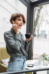 Lovely young girl wearing wireless earphones