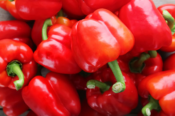 Ripe red peppers as background