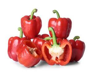 Ripe red peppers on white background