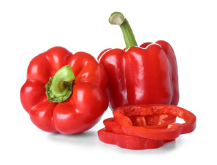 Ripe red peppers on white background