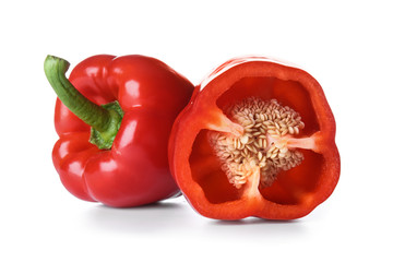 Ripe red peppers on white background