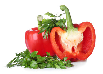 Ripe red peppers on white background