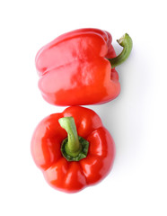 Ripe red peppers on white background