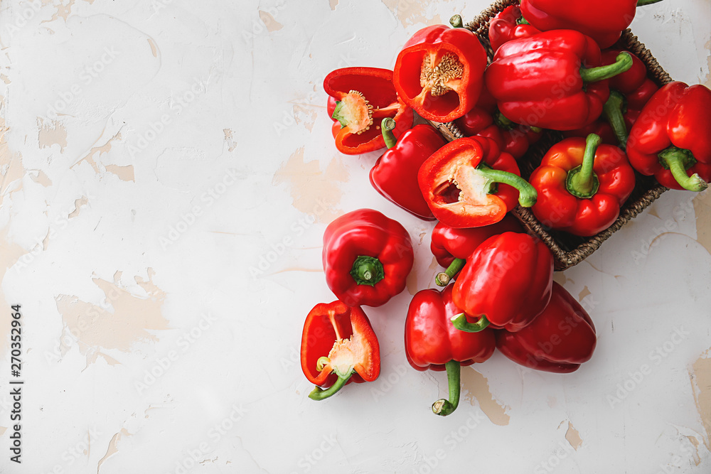 Wall mural ripe red peppers on light background