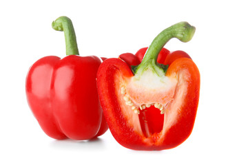Ripe red peppers on white background