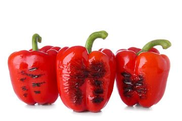 Grilled red peppers on white background