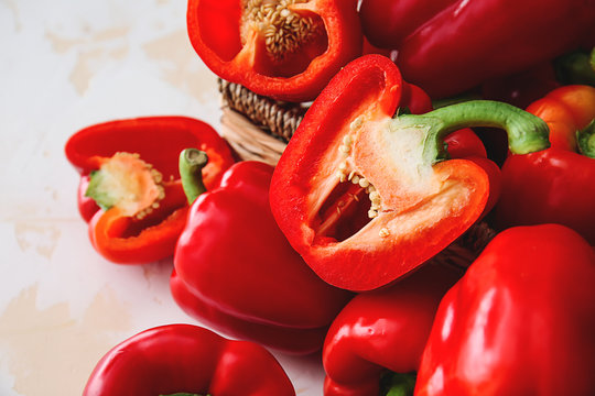 Ripe red peppers on light background