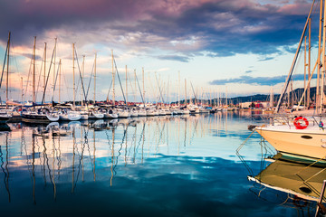 Great summer sunset in port of old fishing town Izola. Colorful spring evening on Adriatic Sea....
