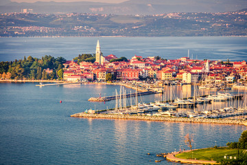 Aerial view of old fishing town Izola. Colorful spring evening on Adriatic Sea. Beautiful seascape...