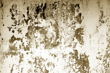 Сraked weathered cement wall texture in brown tone.