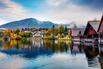 Fototapeta premium Splendid autumn sunrise on Grundlsee lake. Amazing morning scene of Brauhof village, Styria stare of Austria, Europe. Colorful view of Alps. Traveling concept background.