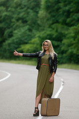Portrait of a lady standing by the road.