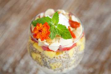 Chia pudding with strawberry, mango and sliced almonds, healthy delicious breakfast option