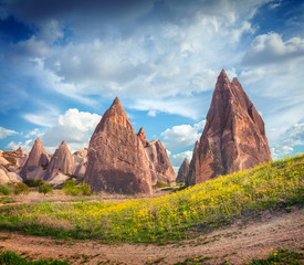 Impressive spring scene of Cappadocia. Picturesque morning view of of Red Rose valley in April. Cavusin village located, district of Nevsehir, Turkey, Asia. Traveling concept background.