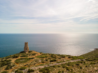 Fototapeta na wymiar Torre del Gerro tower. Ancient 16th century watchtower on the top of a cliff in Denia, Spain