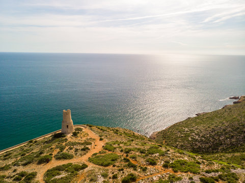 Torre del Gerro tower. Ancient 16th century watchtower on the top of a cliff in Denia, Spain