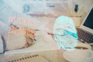 Obraz na płótnie Canvas Fingerprint hologram with businessman working on computer on background. Security concept. Double exposure.